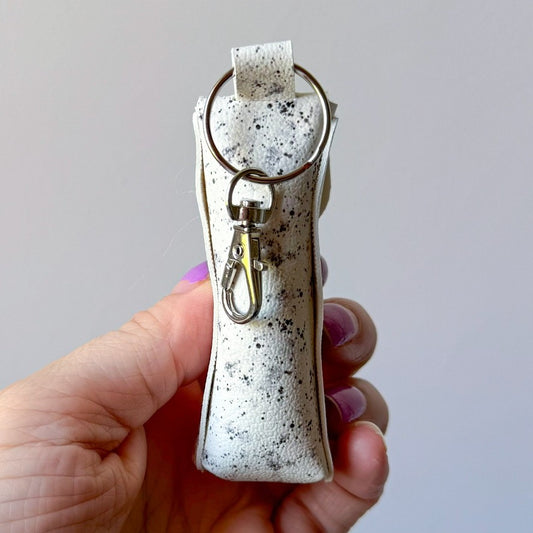 White w/ black splatter chapstick case (00L0HN)