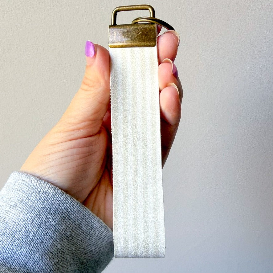 White w/ tan stripes wristlet (00L0J1)