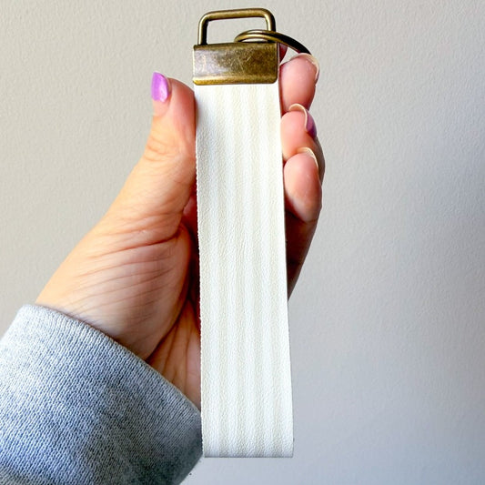 White w/ tan stripes wristlet (00L0J1)