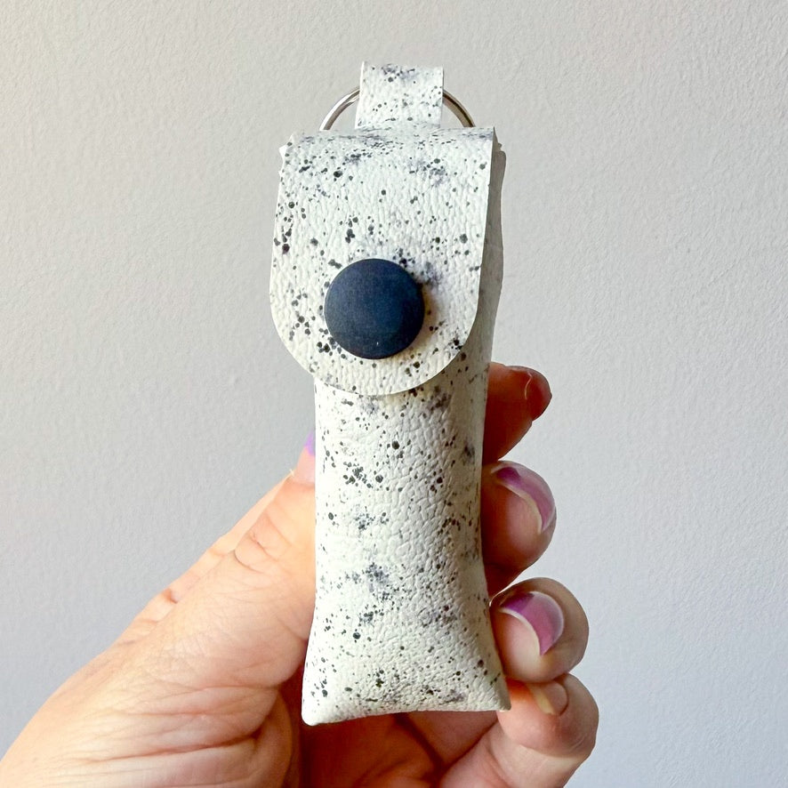 White w/ black splatter chapstick case (00L0HN)