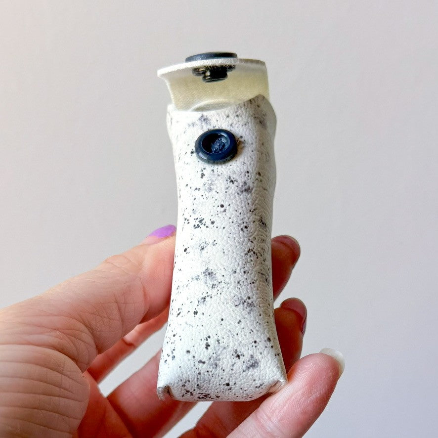 White w/ black splatter chapstick case (00L0HN)
