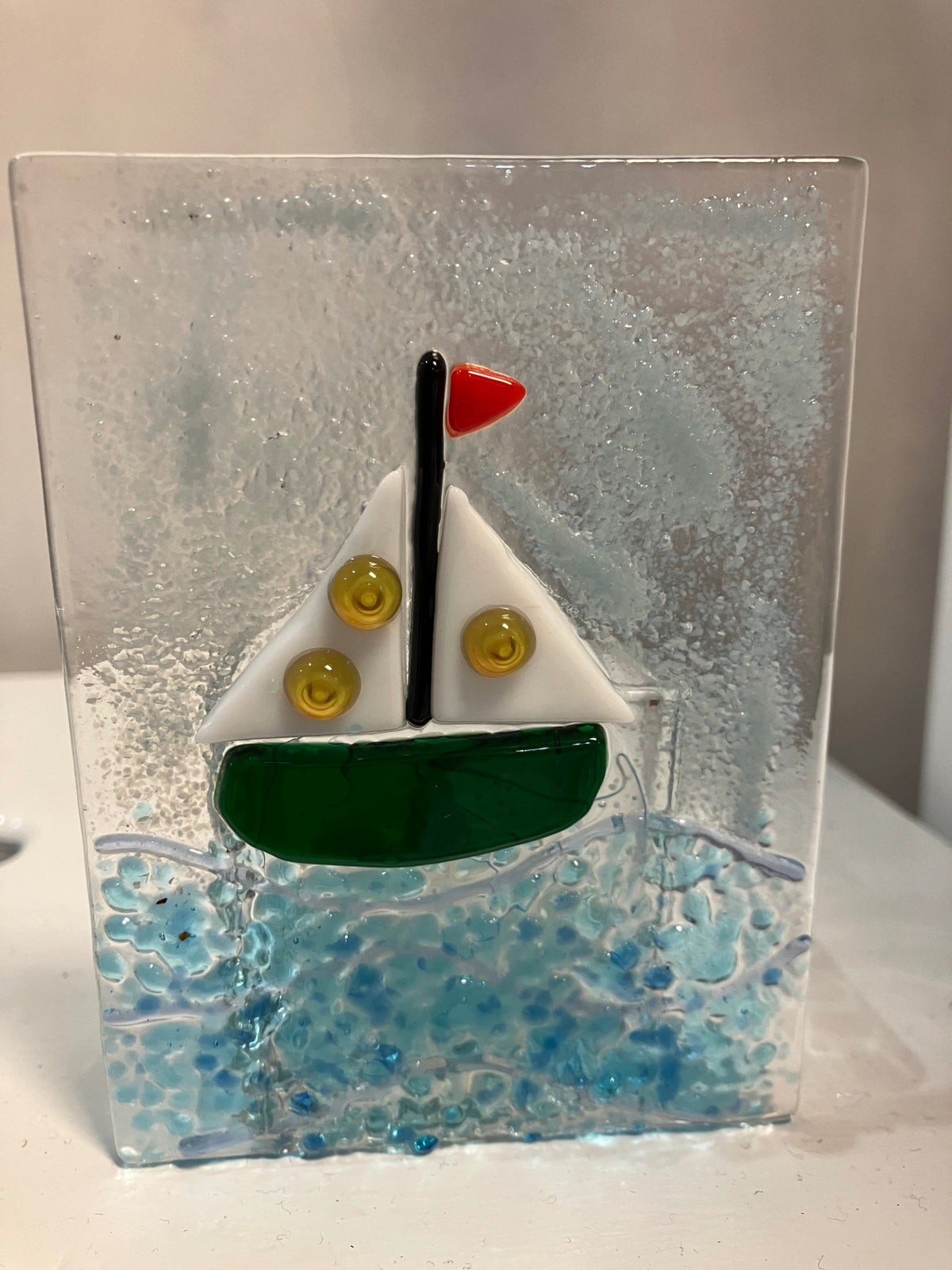 Candle holder w/ electric candle - Clear with multicolor elements (red, black, white, yellow, green, blue) - Unknown