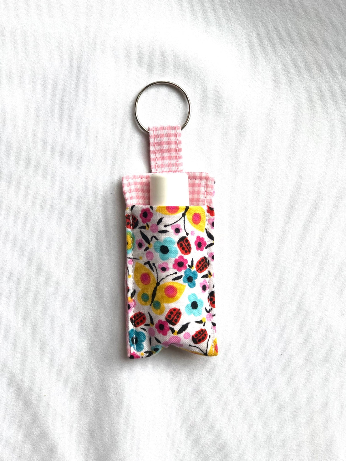 Multicolor Flowers on White Chapstick Holder 