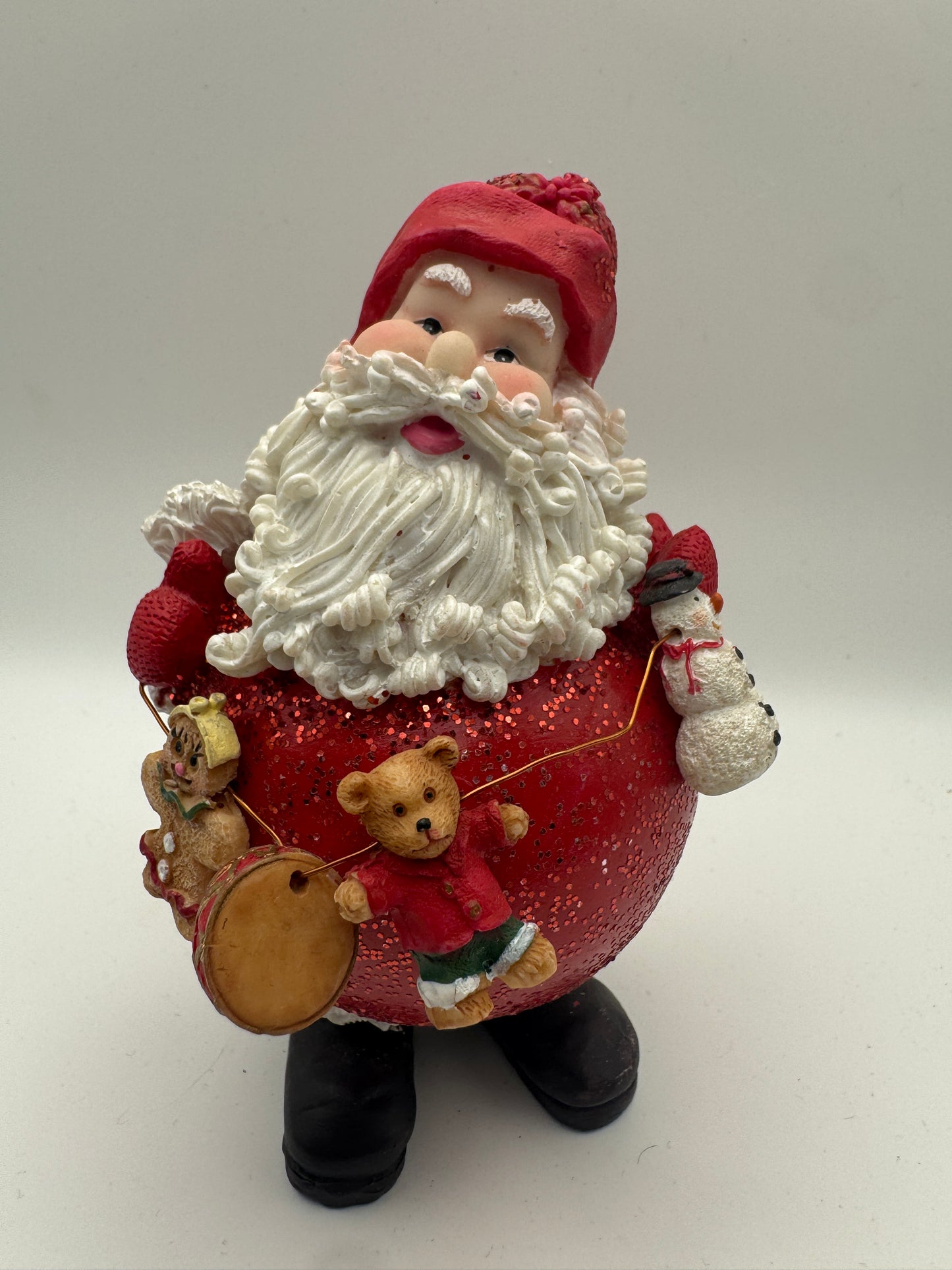 Santa Figurine Holding Toy Garland – Hand-Painted Resin Christmas Decor 5"