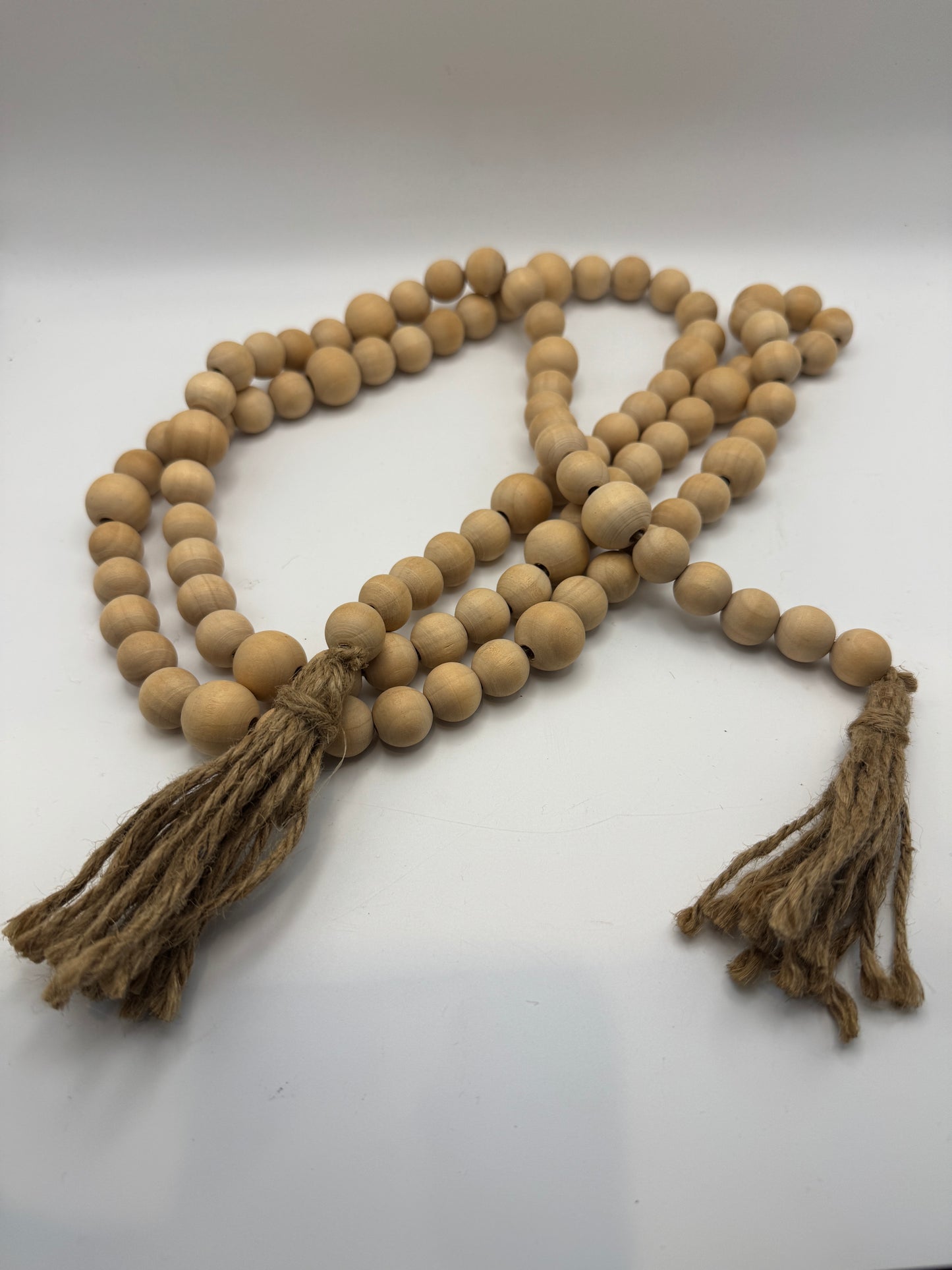Natural Wood Beaded Garland with Jute Tassels – 70"