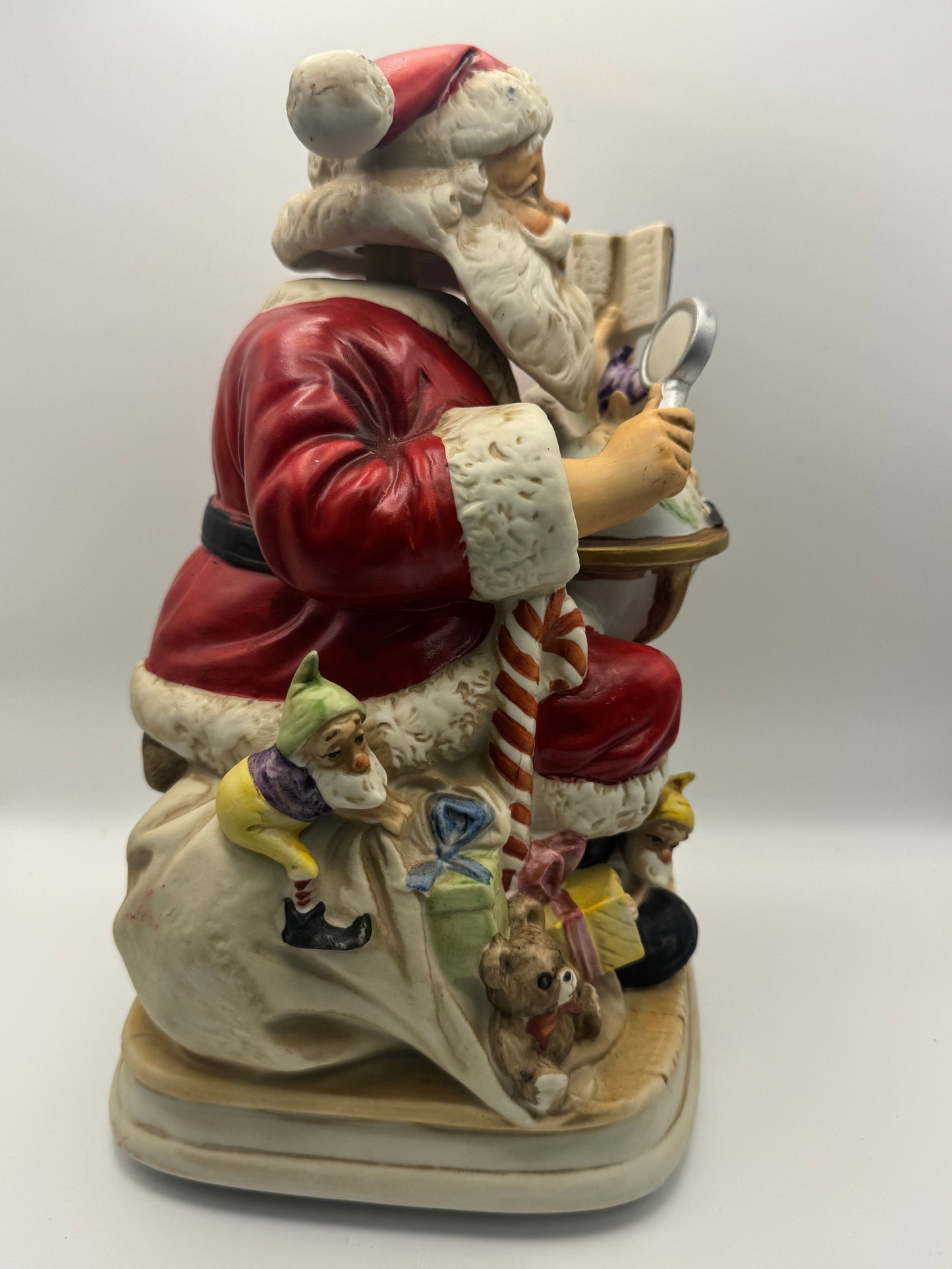 "Santa Claus is Coming to Town," while Santa's head and hands move. 
The figurine is powered by batteries.