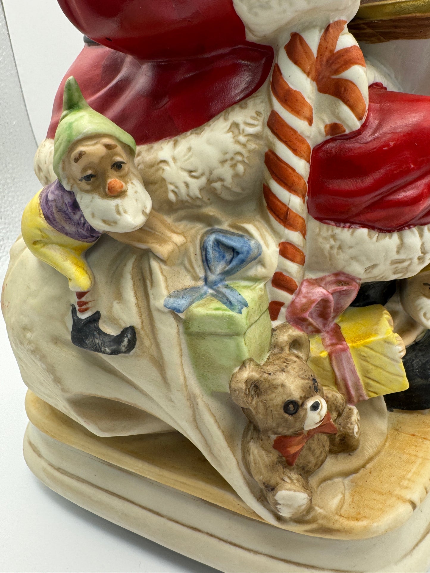 "Santa Claus is Coming to Town," while Santa's head and hands move. 
The figurine is powered by batteries.