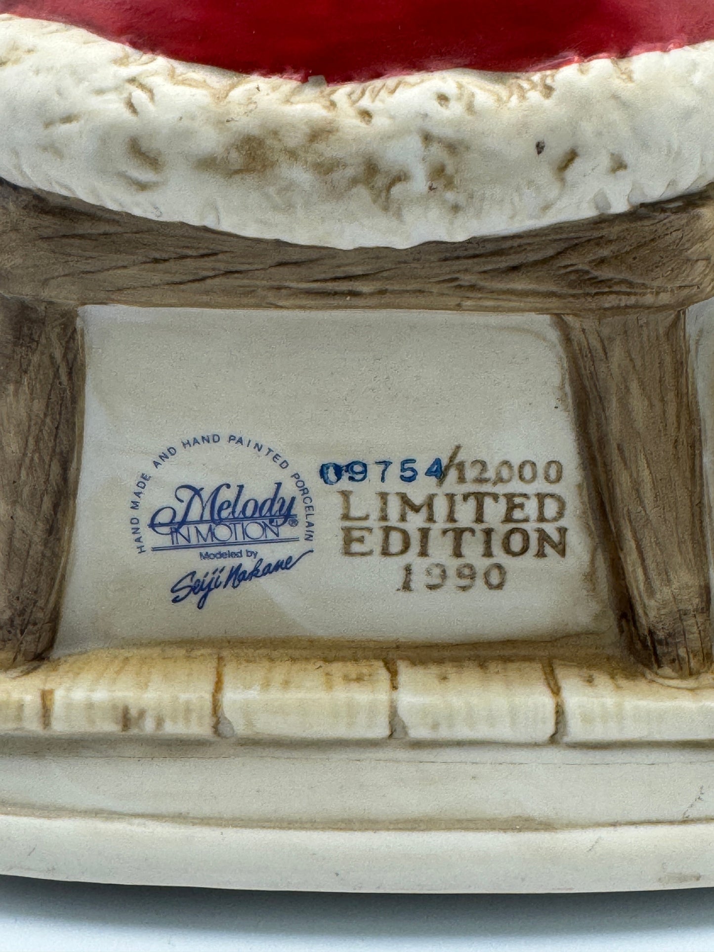 "Santa Claus is Coming to Town," while Santa's head and hands move. 
The figurine is powered by batteries.