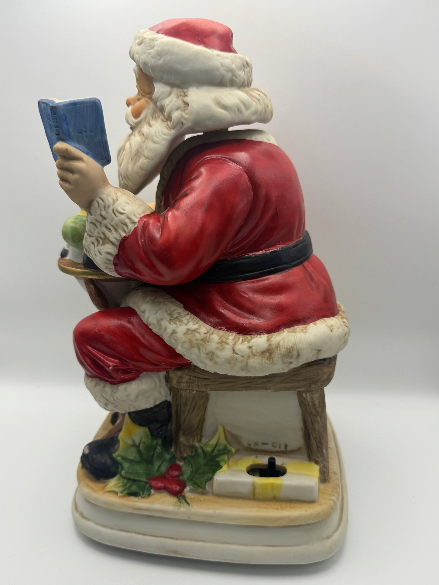 "Santa Claus is Coming to Town," while Santa's head and hands move. 
The figurine is powered by batteries.