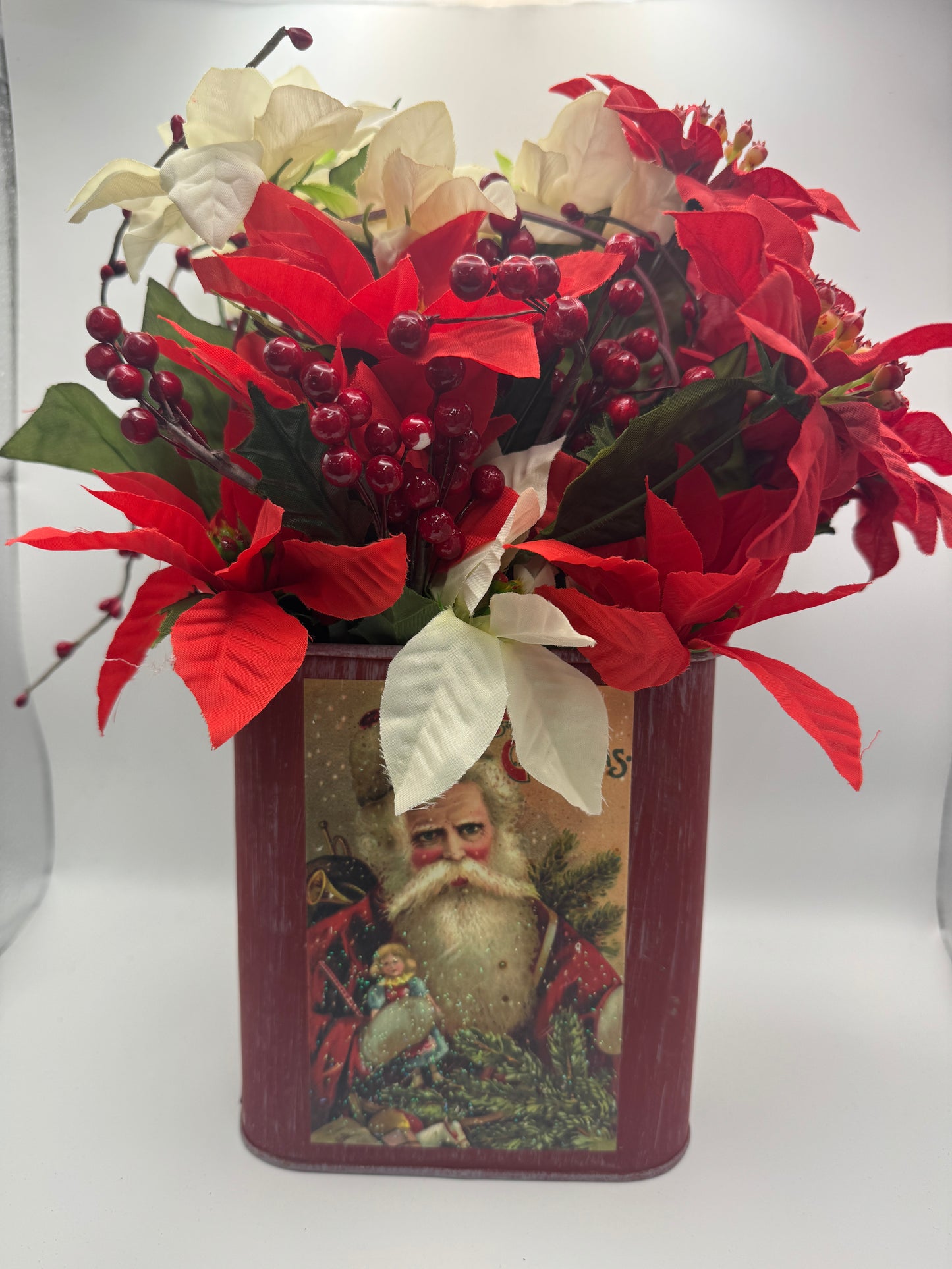 Santa Tin Christmas Centerpiece with Poinsettias and Red Berries