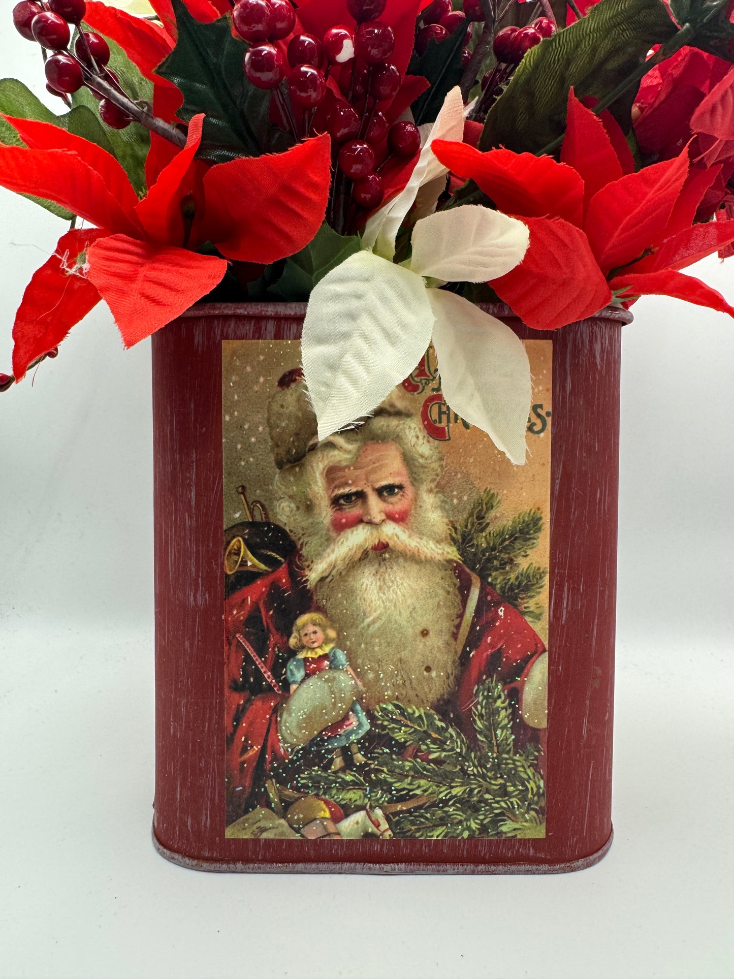 Santa Tin Christmas Centerpiece with Poinsettias and Red Berries