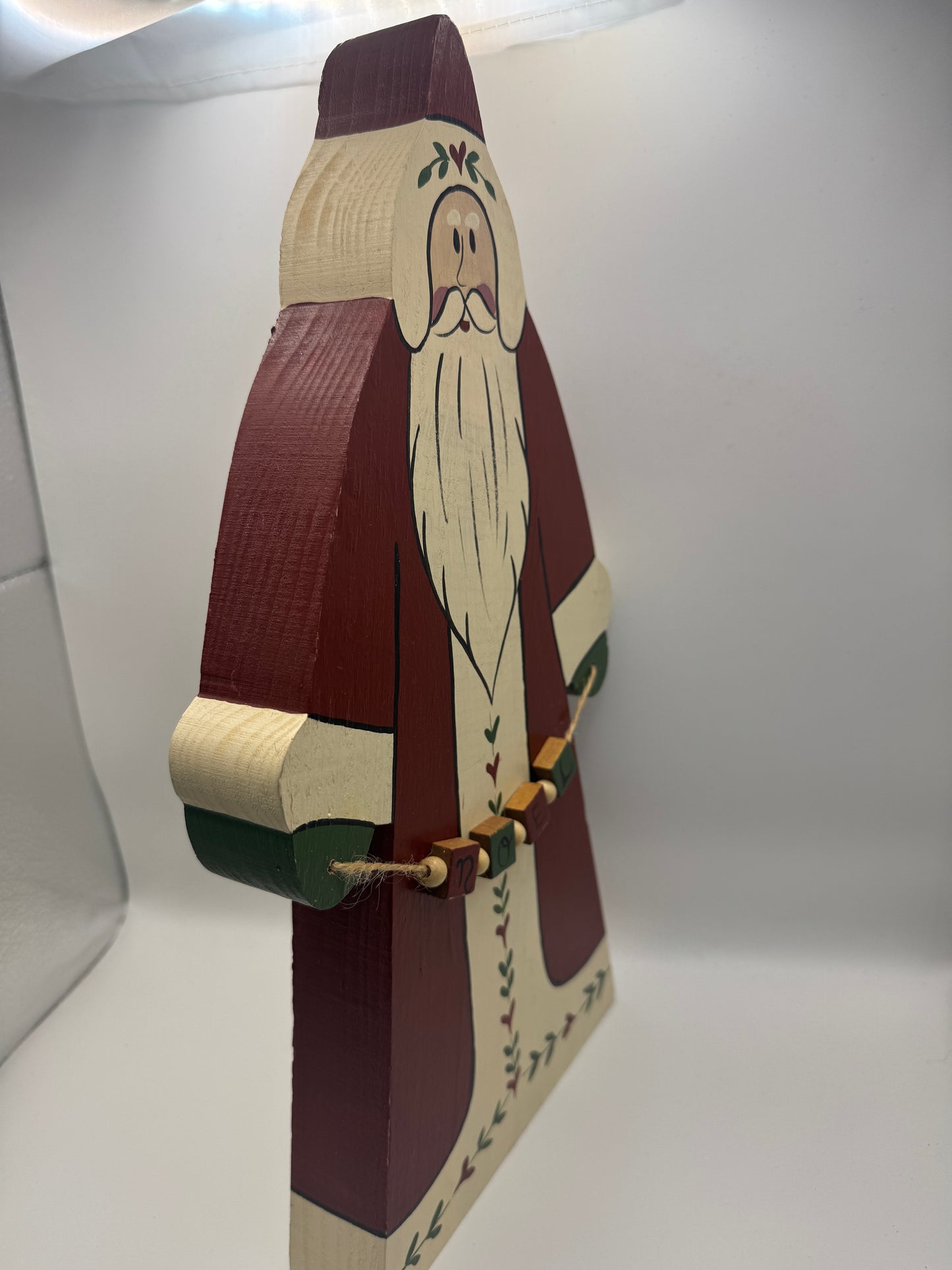 14" Wooden Folk Art Santa Figurine with “NOEL” Garland